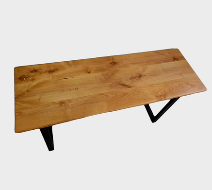A wooden table with metal legs on a white background