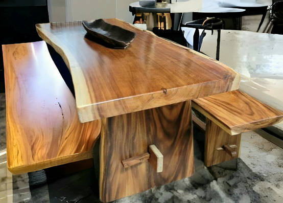 A wooden table with two benches and a bowl on top