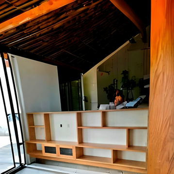 A room with a lot of shelves and a sliding glass door