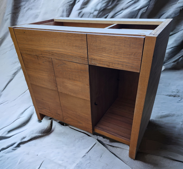 A small wooden cabinet with two drawers and two doors