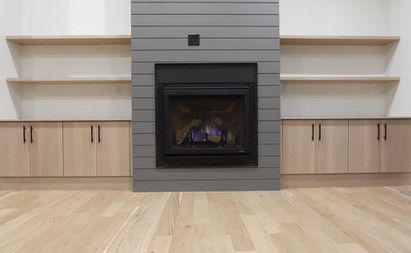 There is a fireplace in the middle of the room.