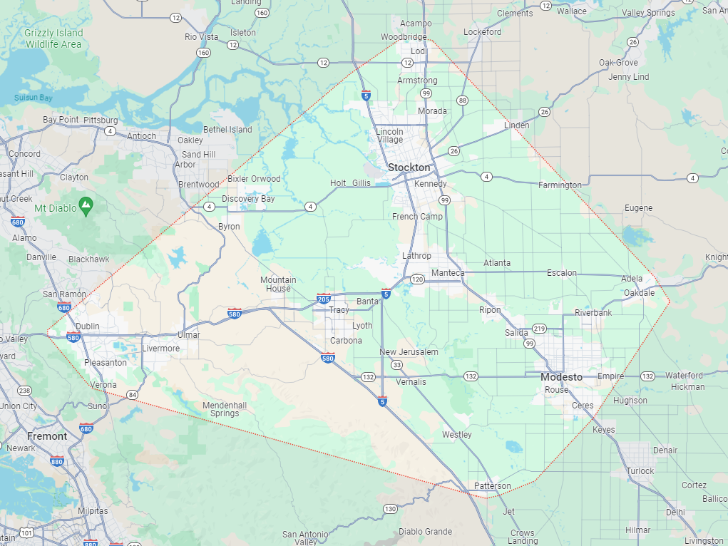 A map of a city with a lot of roads and mountains in the background.