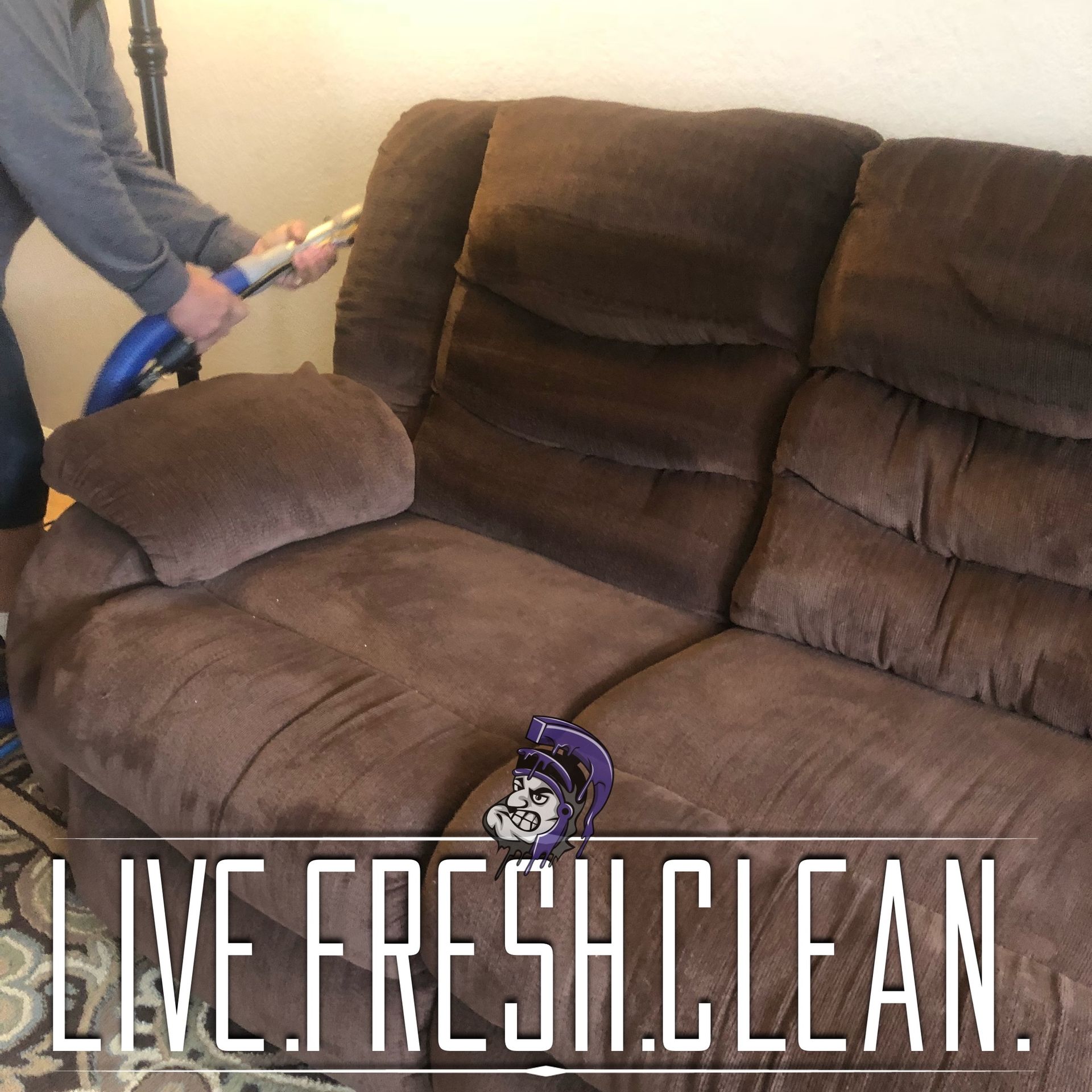 A man is cleaning a couch with a vacuum cleaner and the words live fresh clean