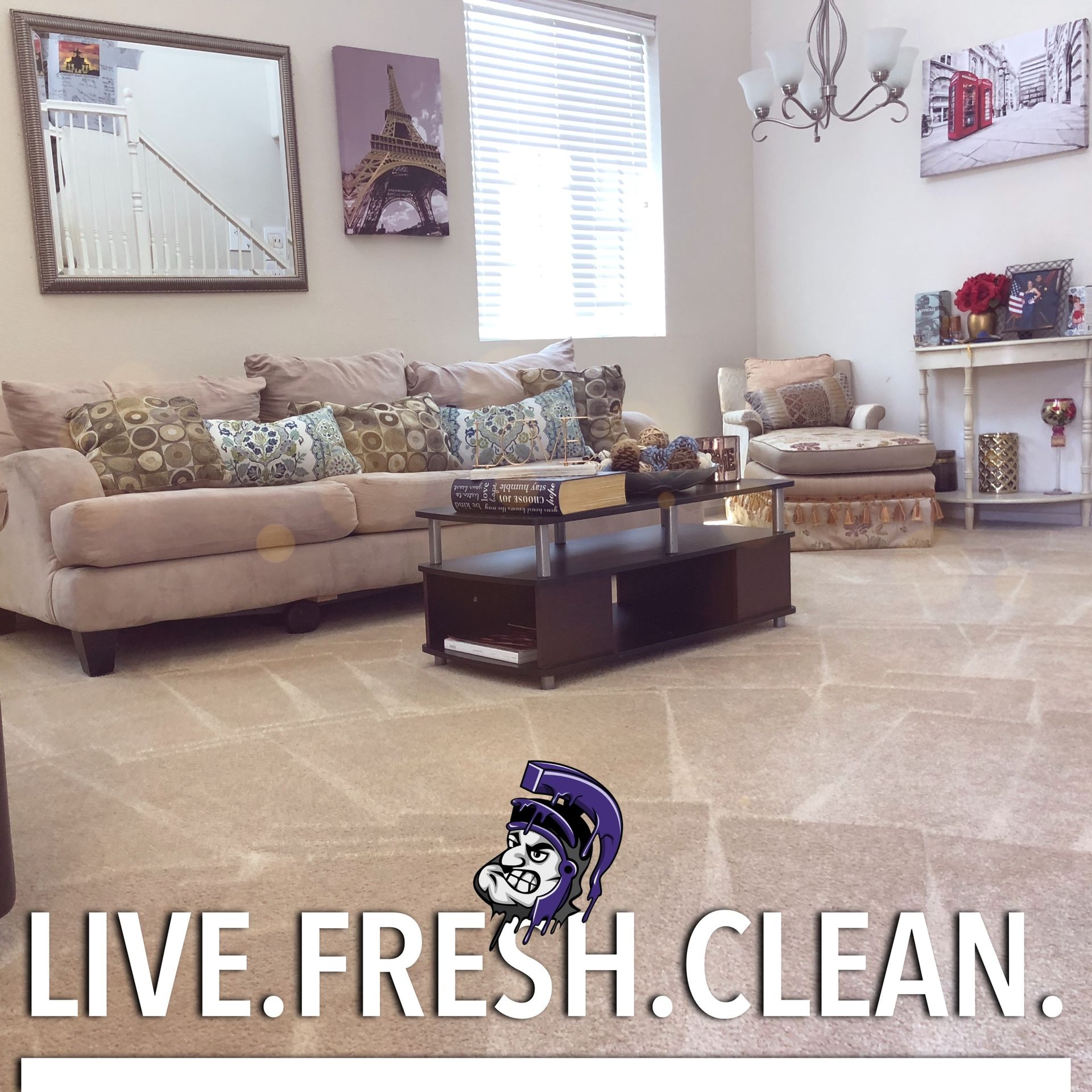 A living room with a couch and a coffee table that says live fresh clean
