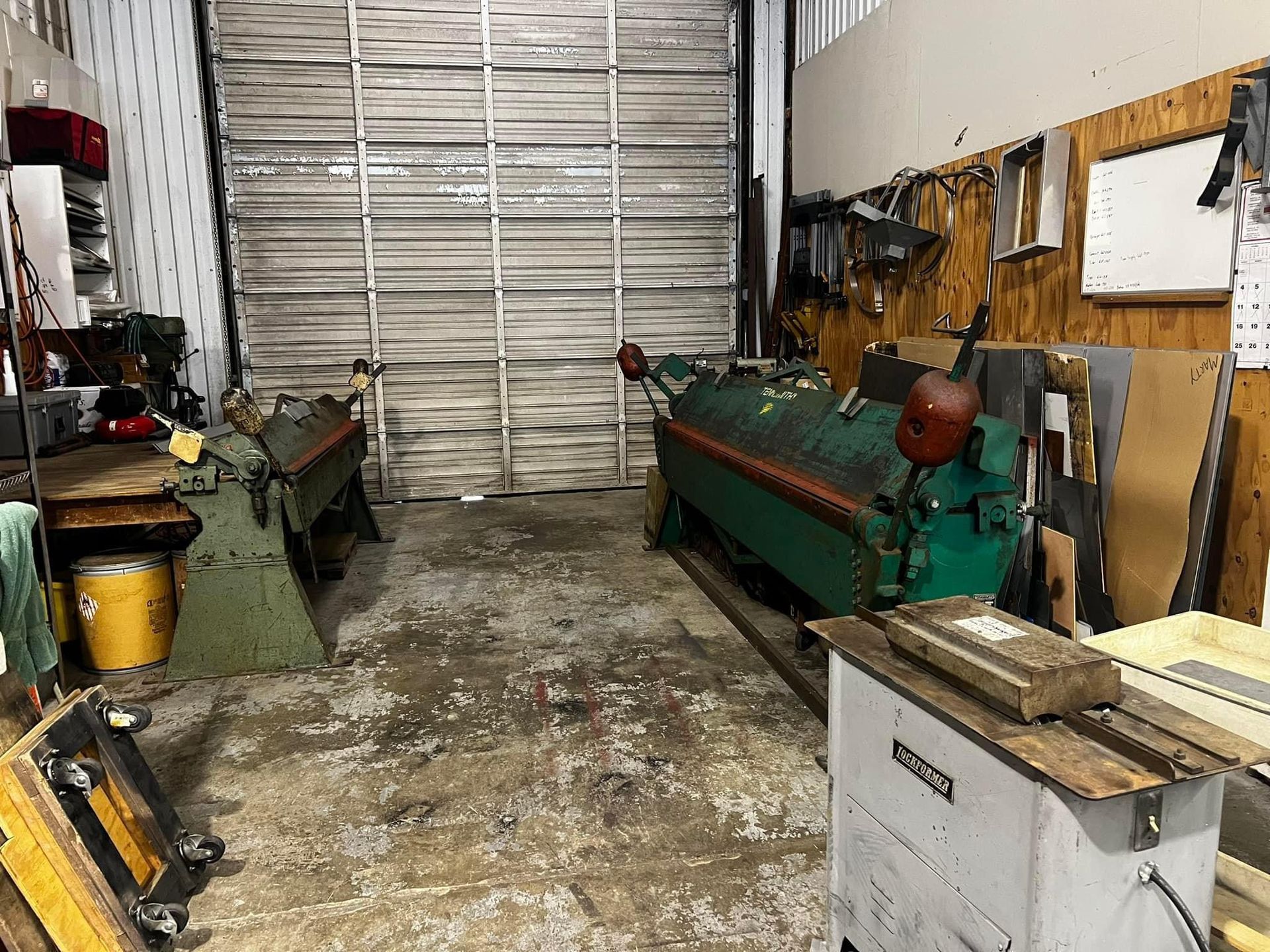 A garage filled with lots of tools and machinery.