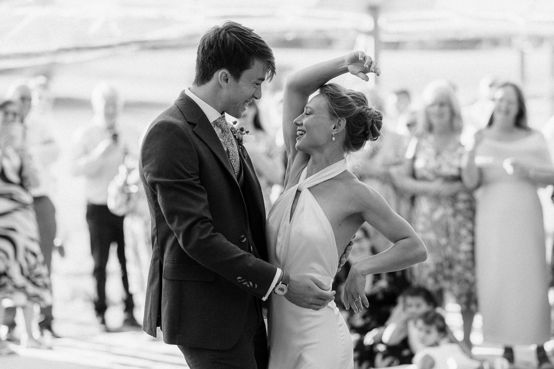 A couple performs their first wedding dance showcasing their style and bond, a choreography perfected in wedding dance classes.