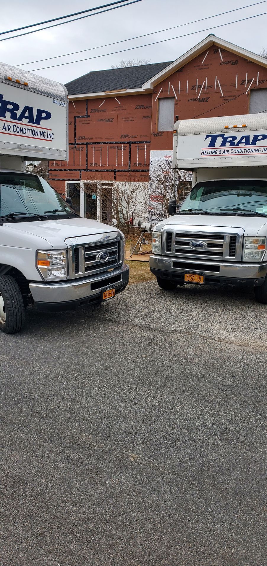 the front view of 2 service trucks