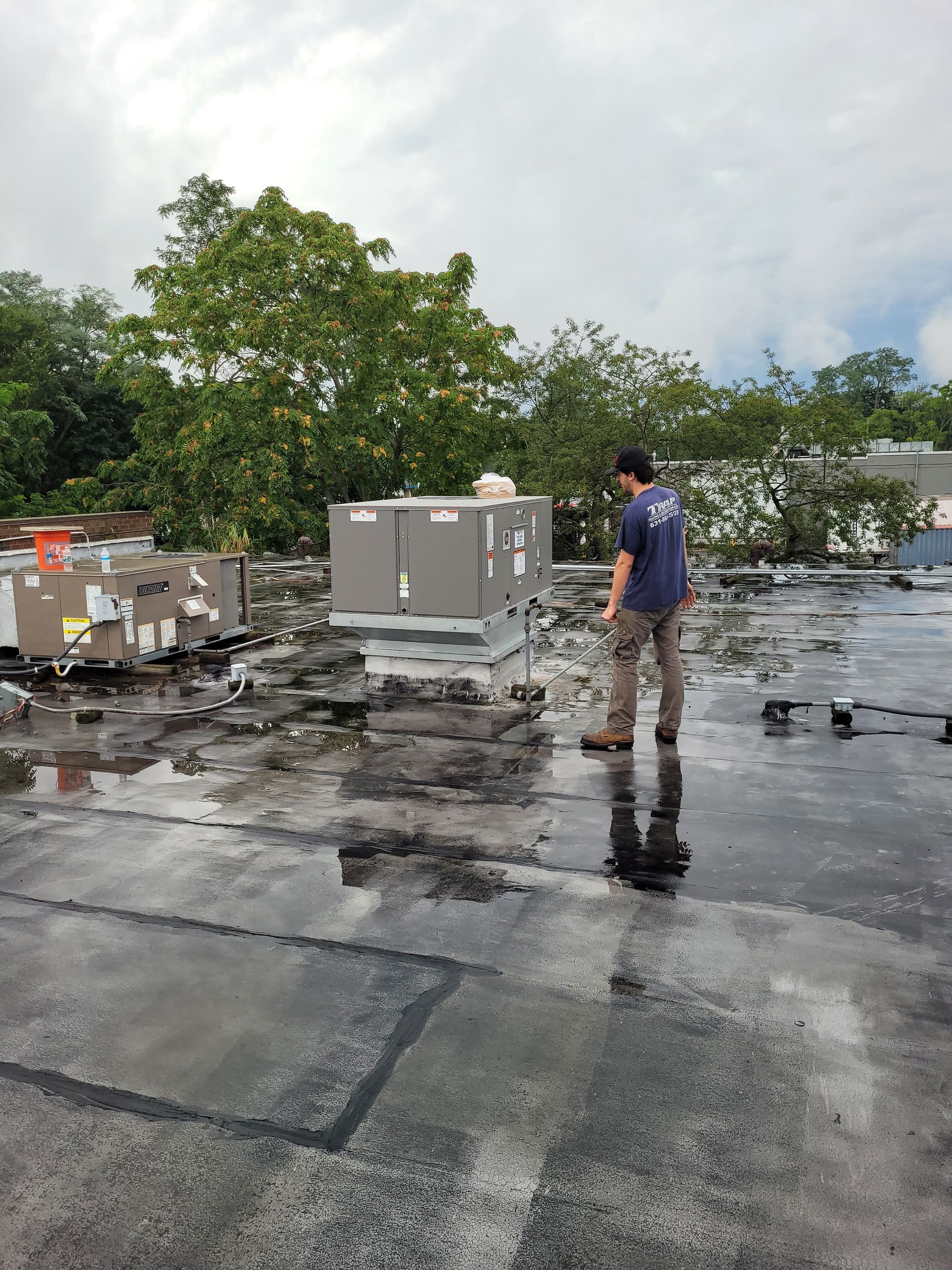 man checking HVAC unit
