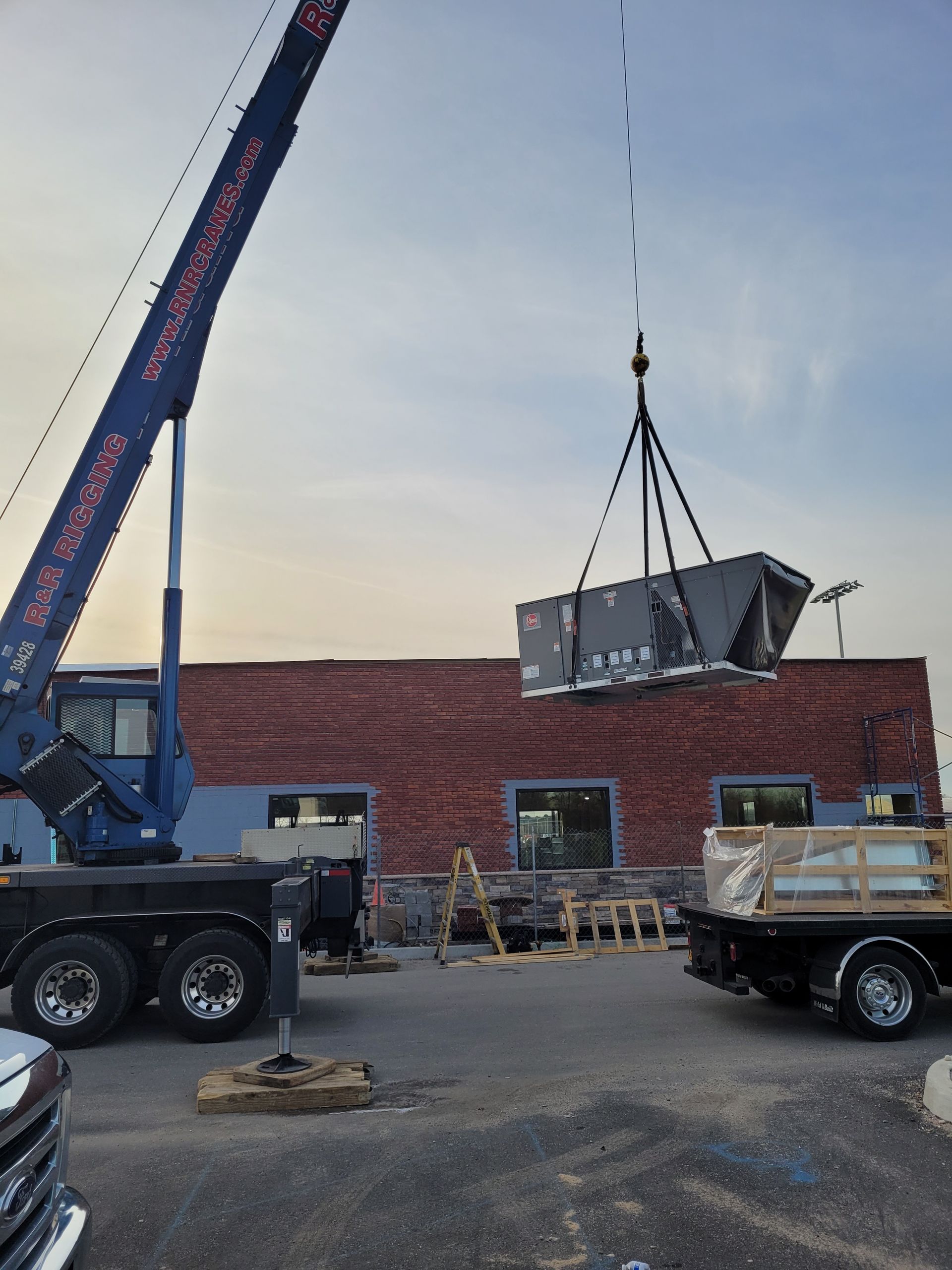 crane lifting AC unit