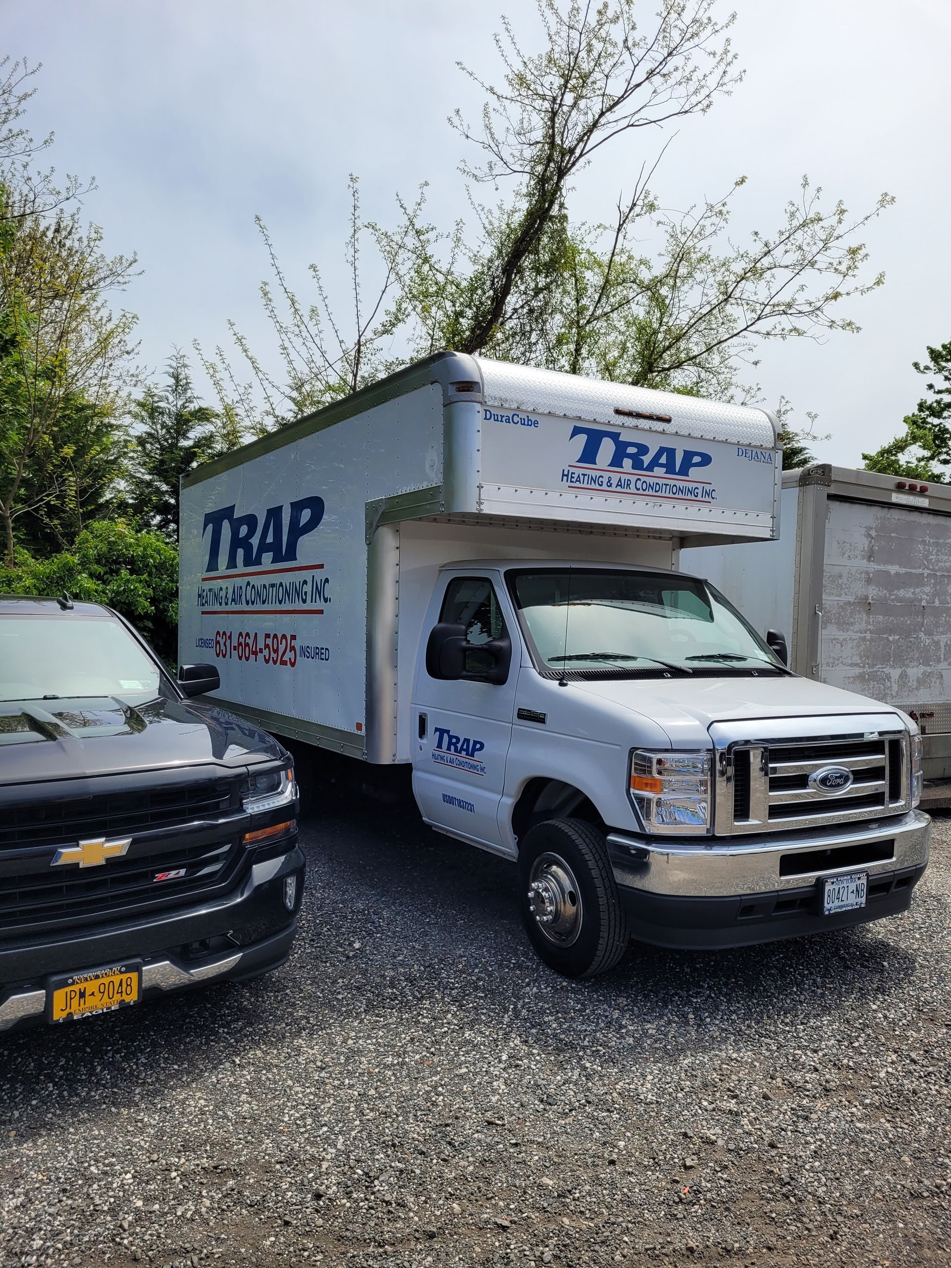 service truck next to pickup truck