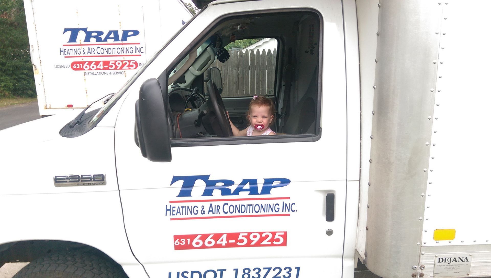 baby sitting in service truck