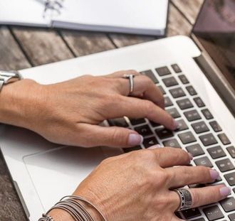 Person typing on a laptop