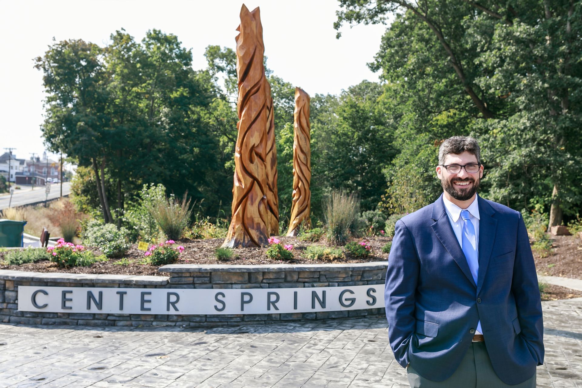 Geoff Luxenberg is standing in front of a sign that says center springs.