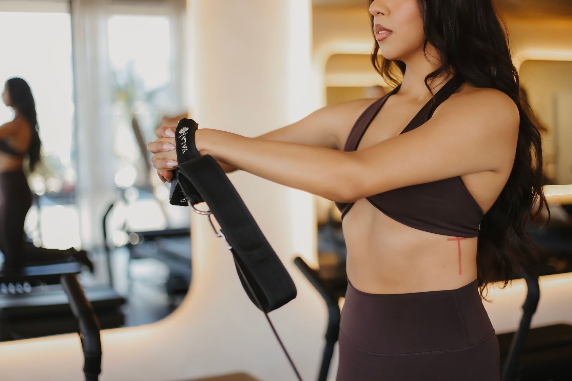 Members training on reformer machines at YALA Evolved Pilates Orange County