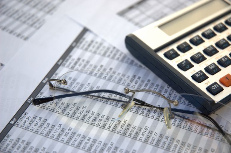 Eyeglasses and a Calculator — Northern Accounting Solutions In Brisbane, QLD