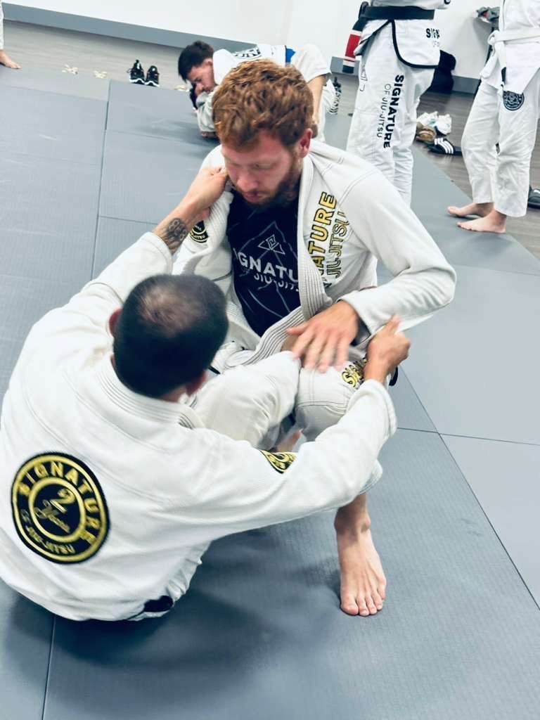 Students training Brazilian Jiu-Jitsu at Signature of Jiu-Jitsu in Belmont, CA, building resilience.