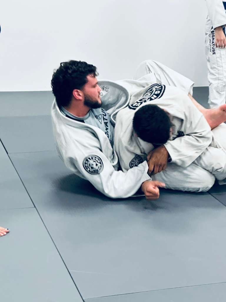 Students training Brazilian Jiu-Jitsu at Signature of Jiu-Jitsu in Belmont, CA.