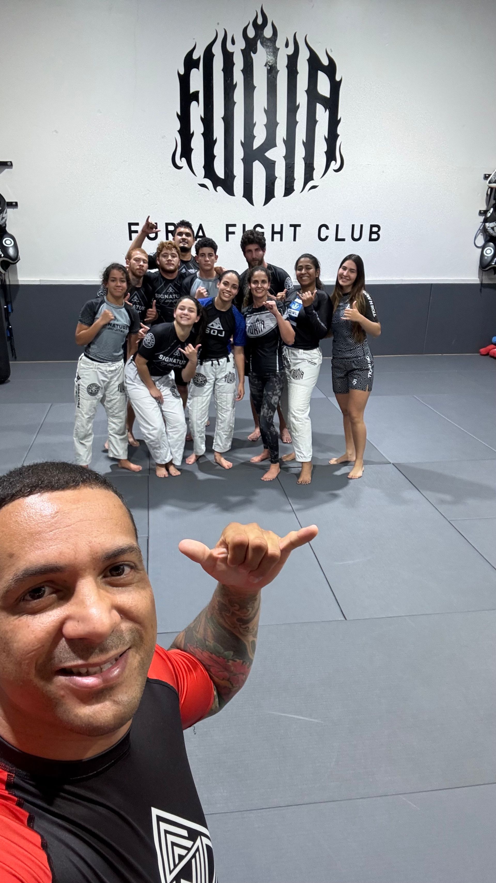 Adult students drilling Jiu-Jitsu techniques at Signature of Jiu-Jitsu in Belmont, CA, building skill and confidence.