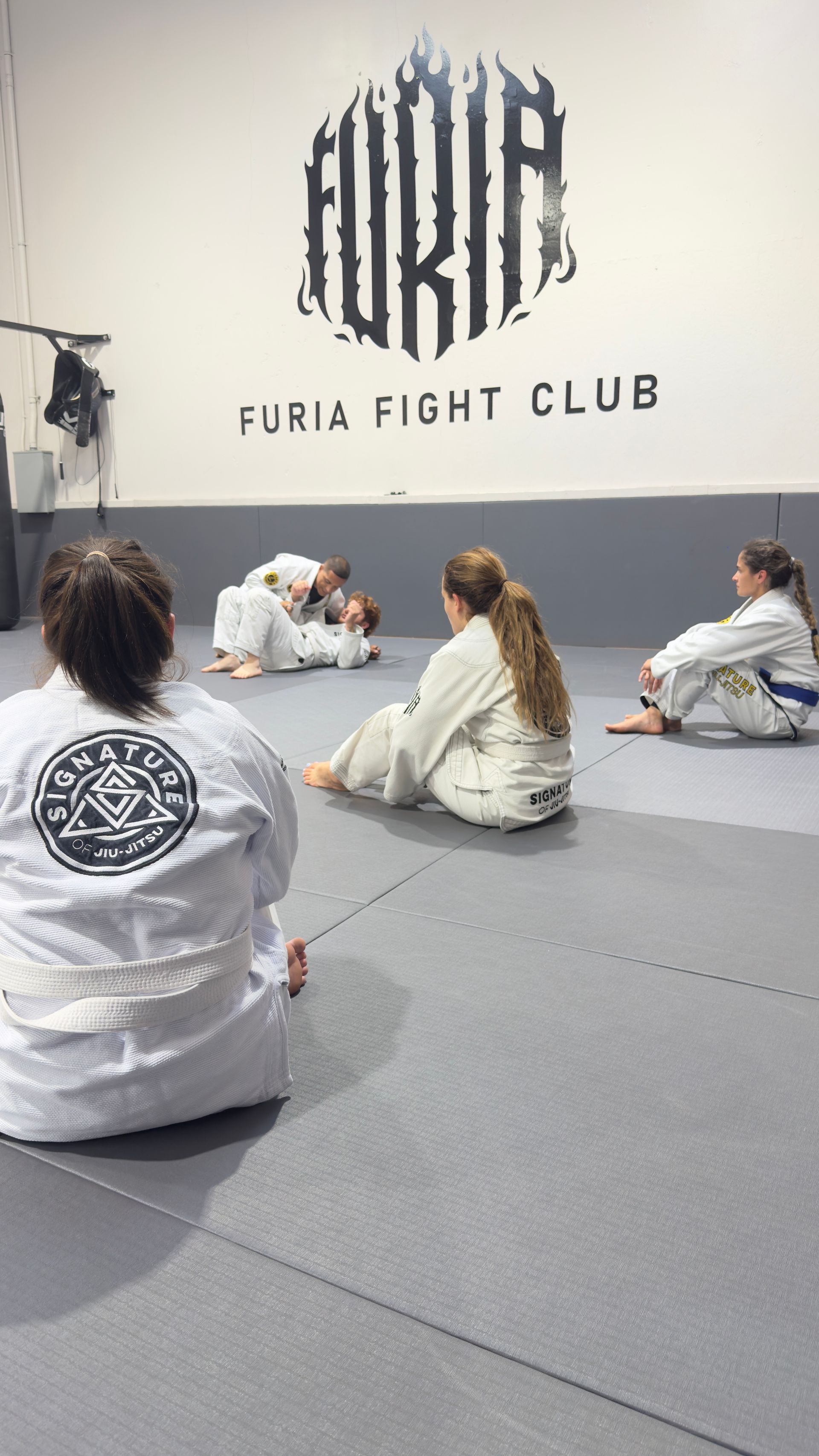 Kids practicing Youth Jiu-Jitsu drills at Signature of Jiu-Jitsu in Belmont, CA, building focus. 