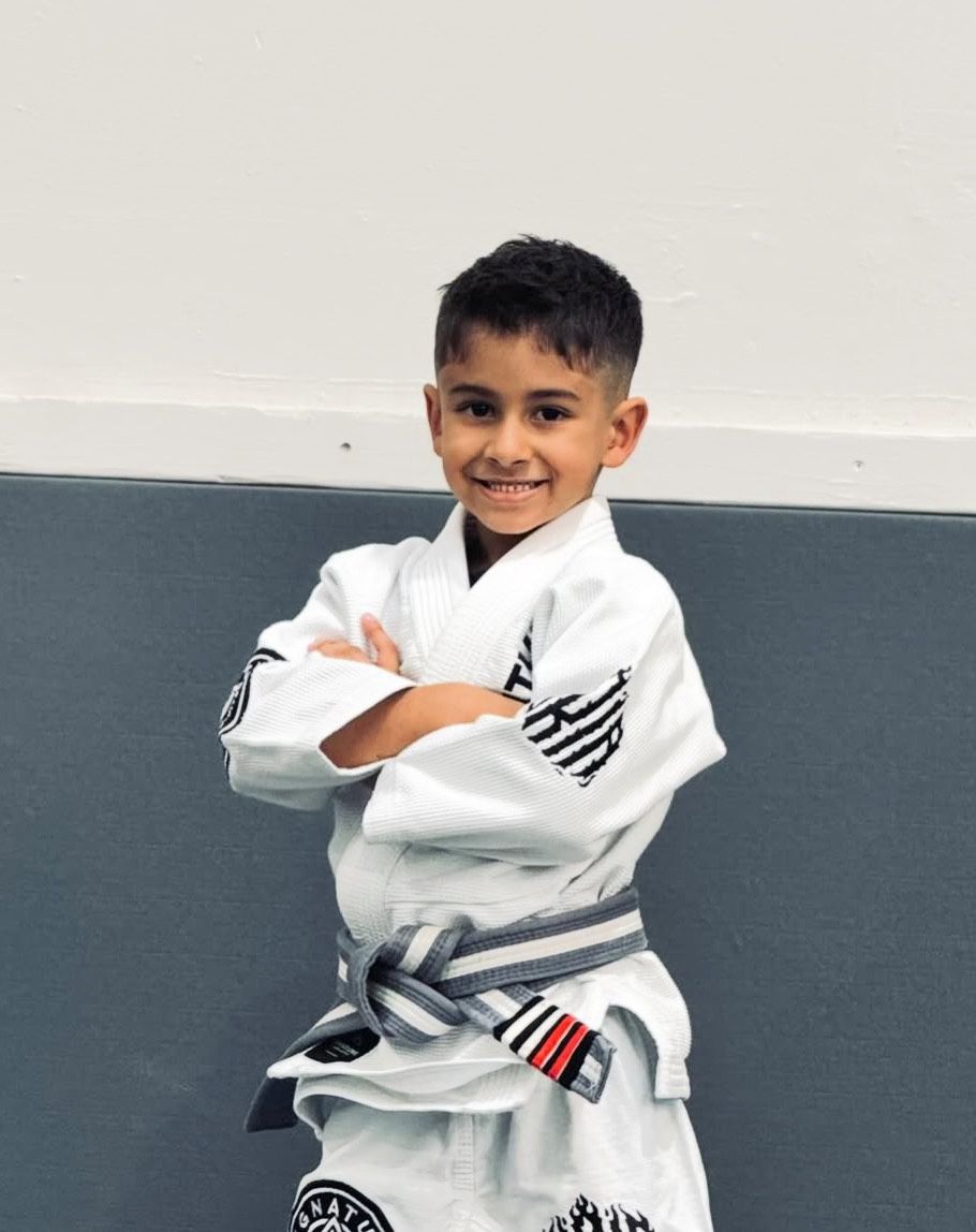 Kids practicing BJJ partner drills at Signature of Jiu-Jitsu in Belmont, CA, building confidence.