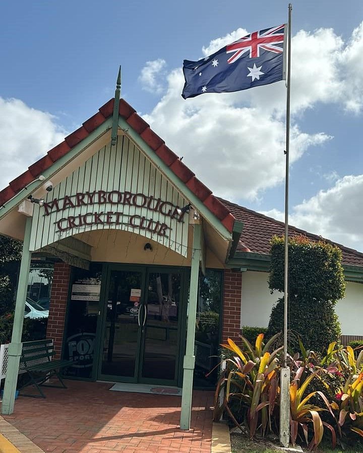 A Flag Is Flying In Front Of A Building That Says Maryborough Cricket Club — Maryborough Cricket Club In Maryborough, QLD