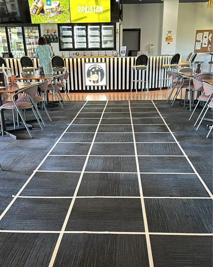 A Restaurant With Tables And Chairs And A Checkered Floor — Maryborough Cricket Club In Maryborough, QLD