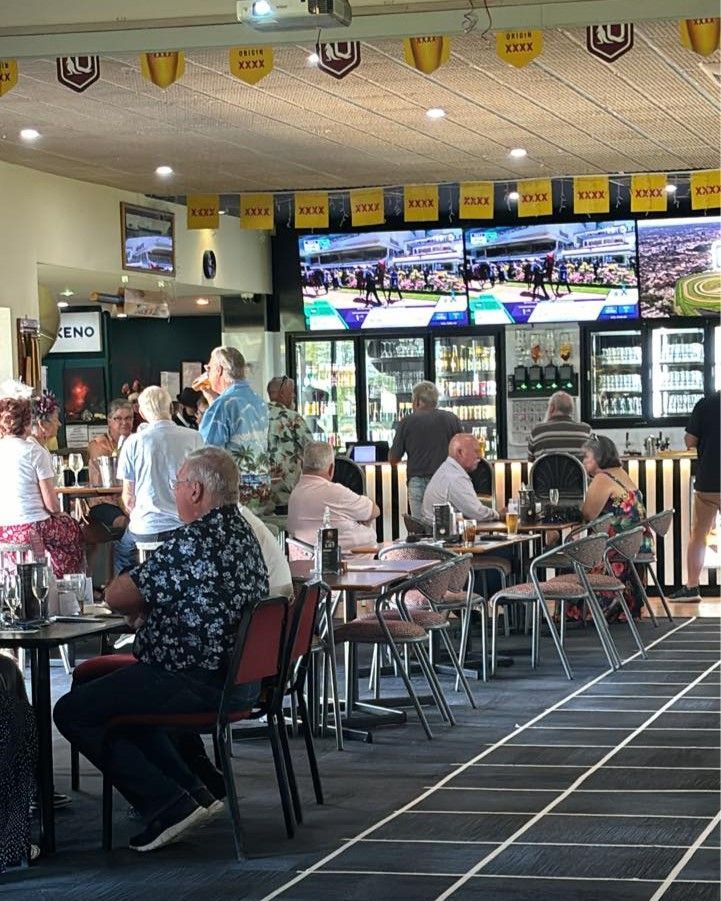 A Group Of People Are Sitting At Tables In A Restaurant — Maryborough Cricket Club In Maryborough, QLD