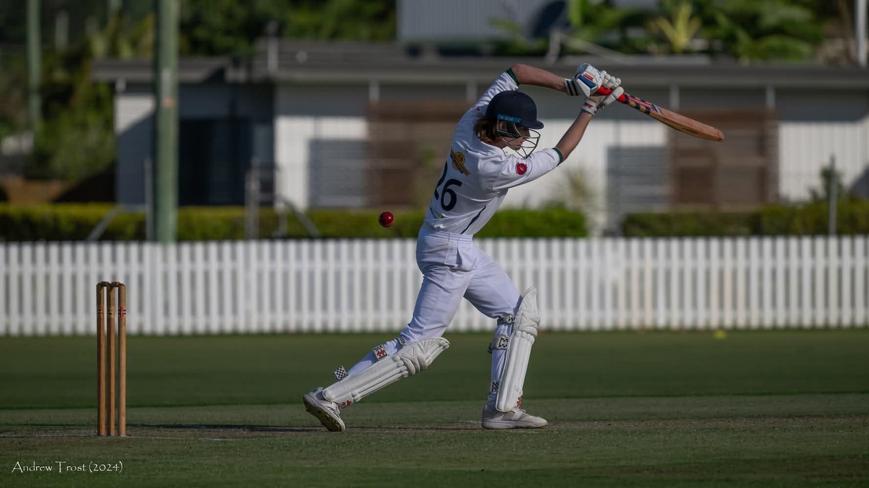 A ManIn A White Uniform Swinging A Cricket Bat — Maryborough Cricket Club In Maryborough, QLD