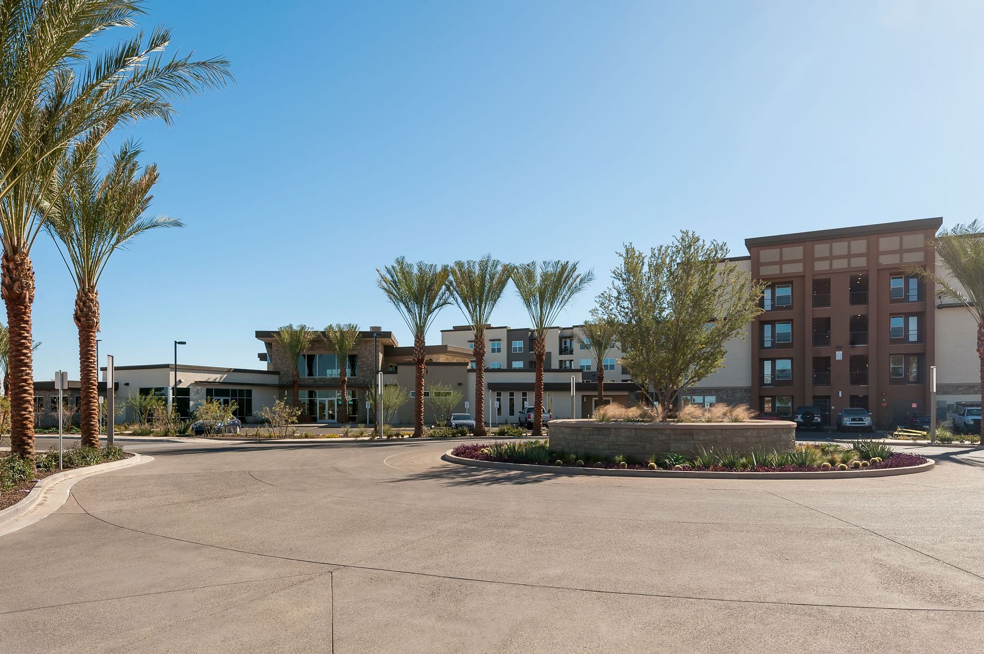 A large building with palm trees in front of it