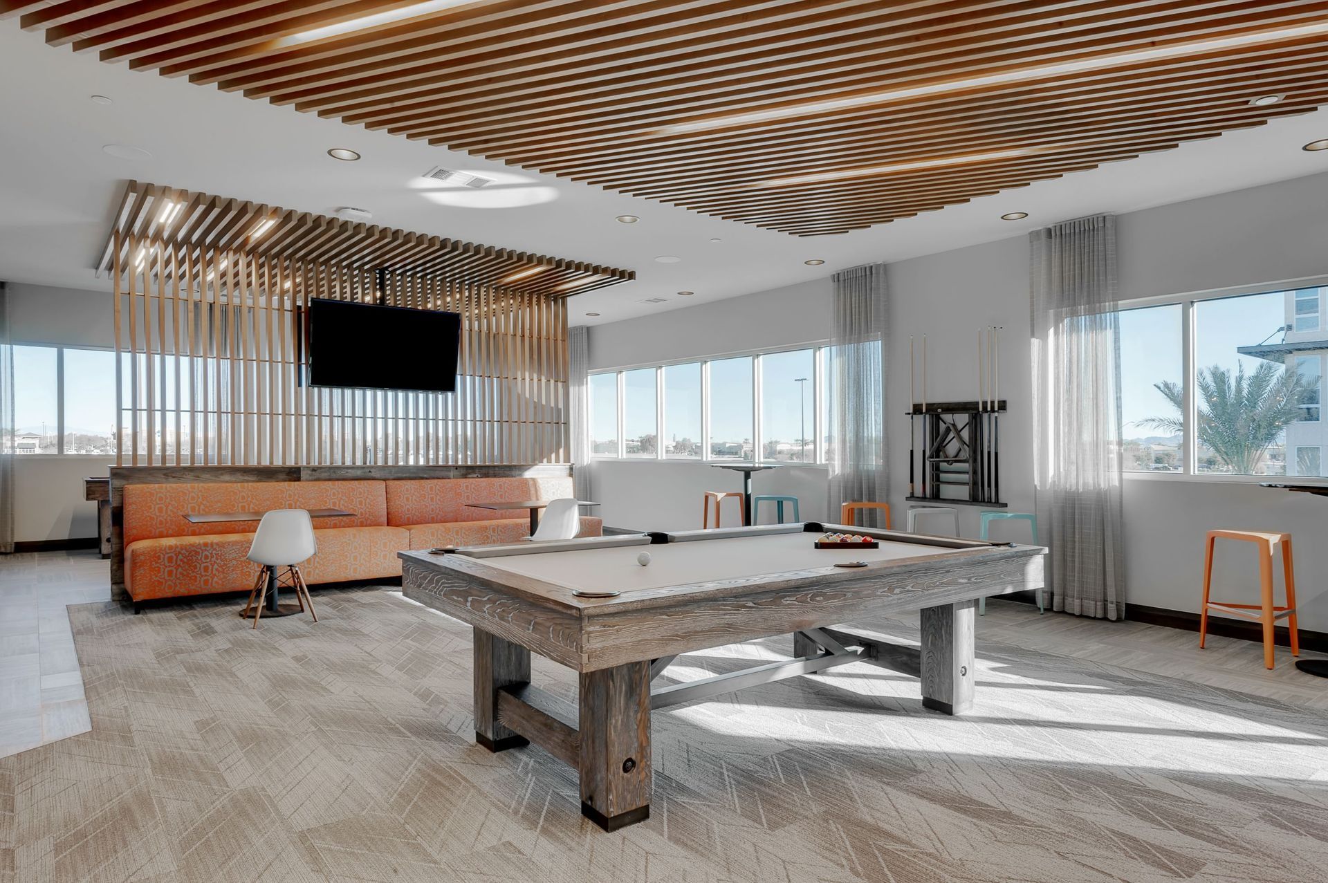 There is a pool table in the middle of the room.