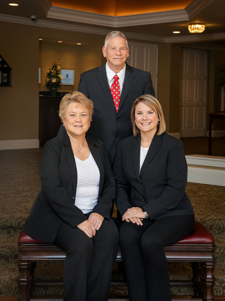 Photo of James and Terri Weldy Johnson-Danielson Funeral Home with Johnson-Danielson logo emblem in right hand corner