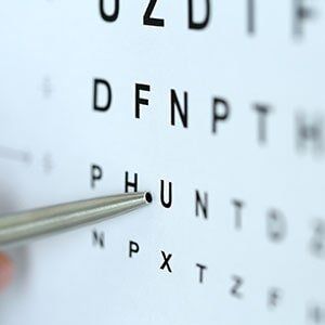 Eye Care — A Pen Pointing To A Letter On An Eye Chart in Georgia, VT
