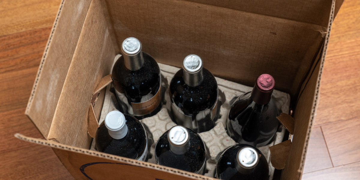 Black marble-look circle with gold accents, including a decorative floral wreath around a central circle.