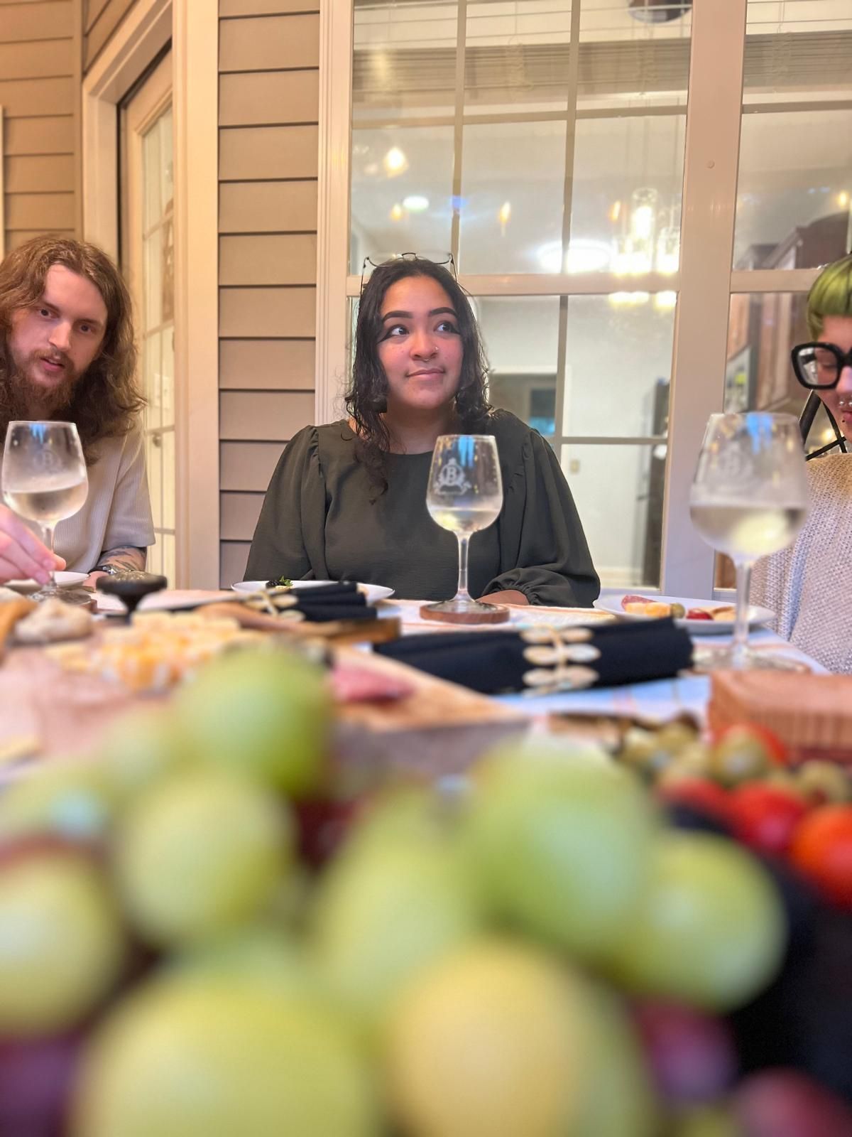Black marble-look circle with gold accents, including a decorative floral wreath around a central circle.
