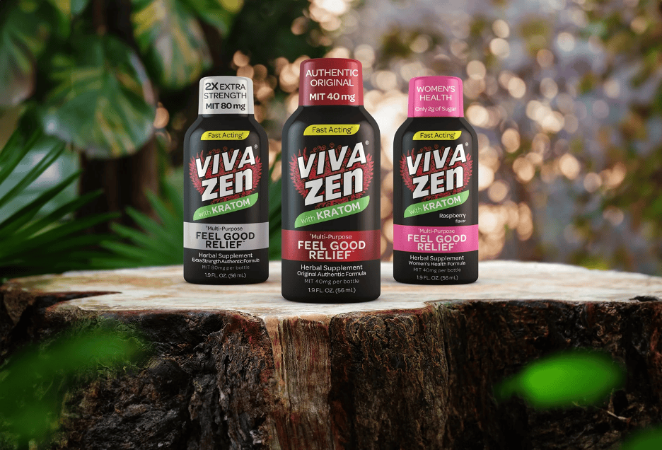 Three bottles of Viva Zen supplements on a tree stump, with green foliage background.