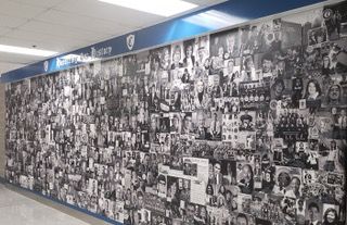 an empty hallway with a sign that says hall of fame