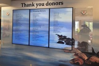 a sign for the university of ontario is on a wall