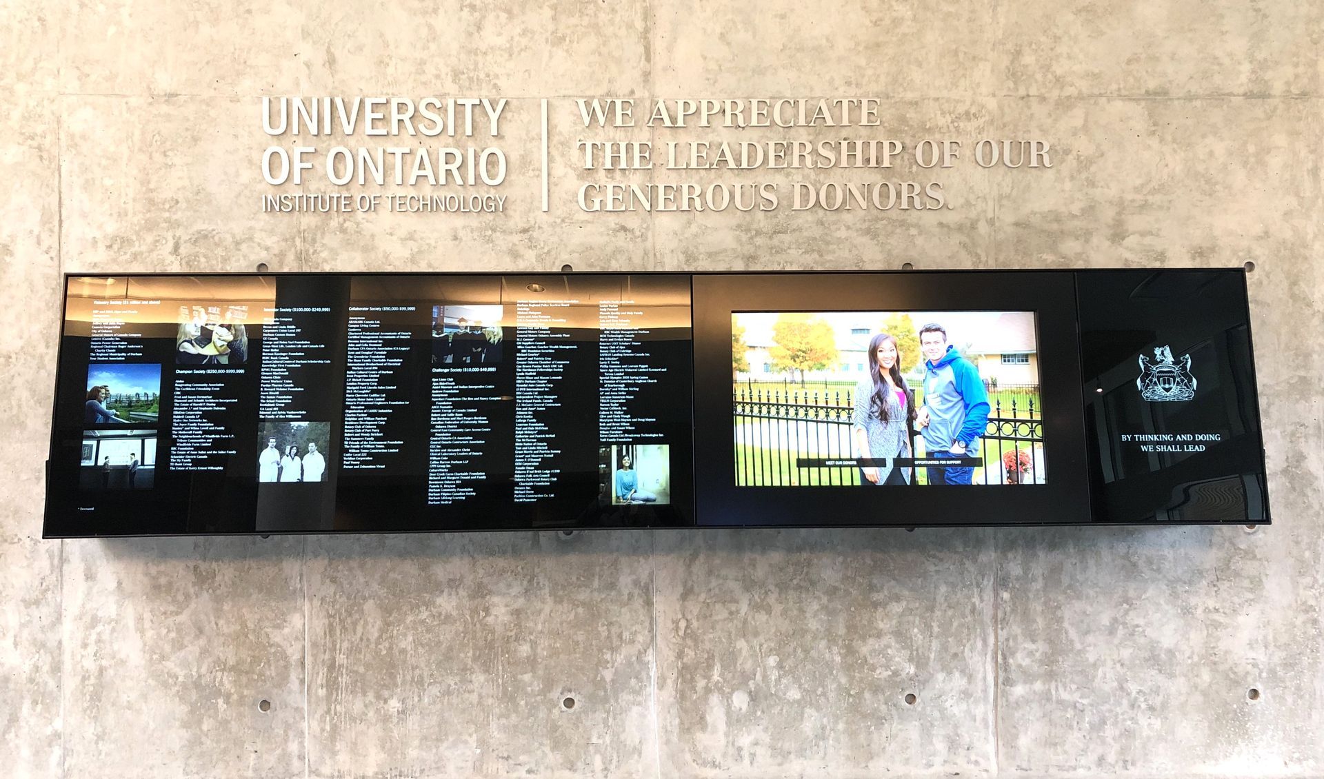 a sign for the university of ontario is on a wall