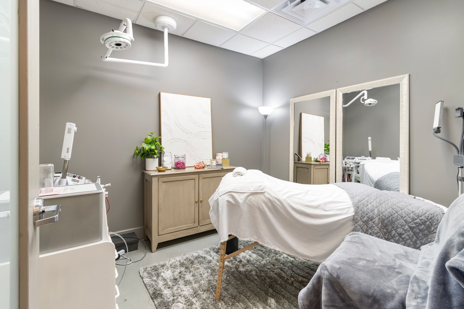 There is a massage table in the middle of the room. Office Tour