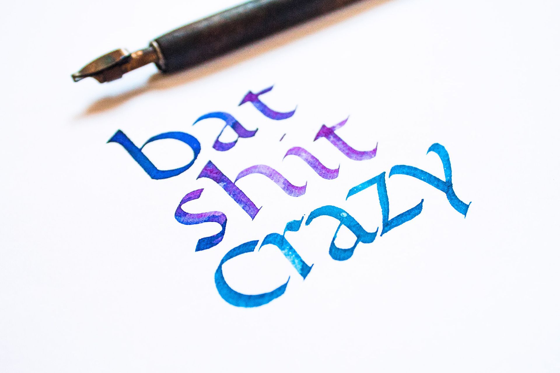 Calligraphy text on white paper reads