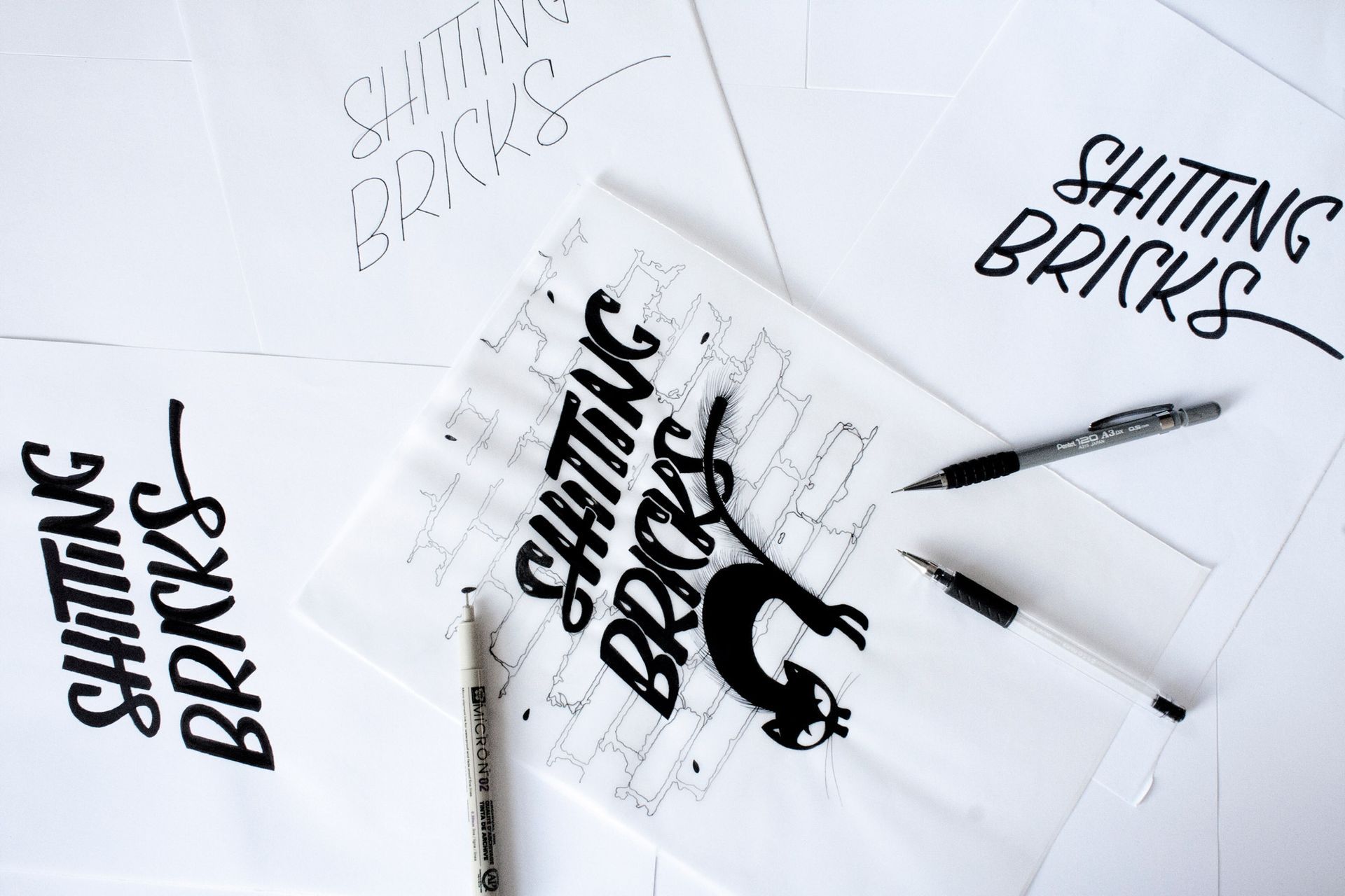 Hand-drawn sketches of the phrase