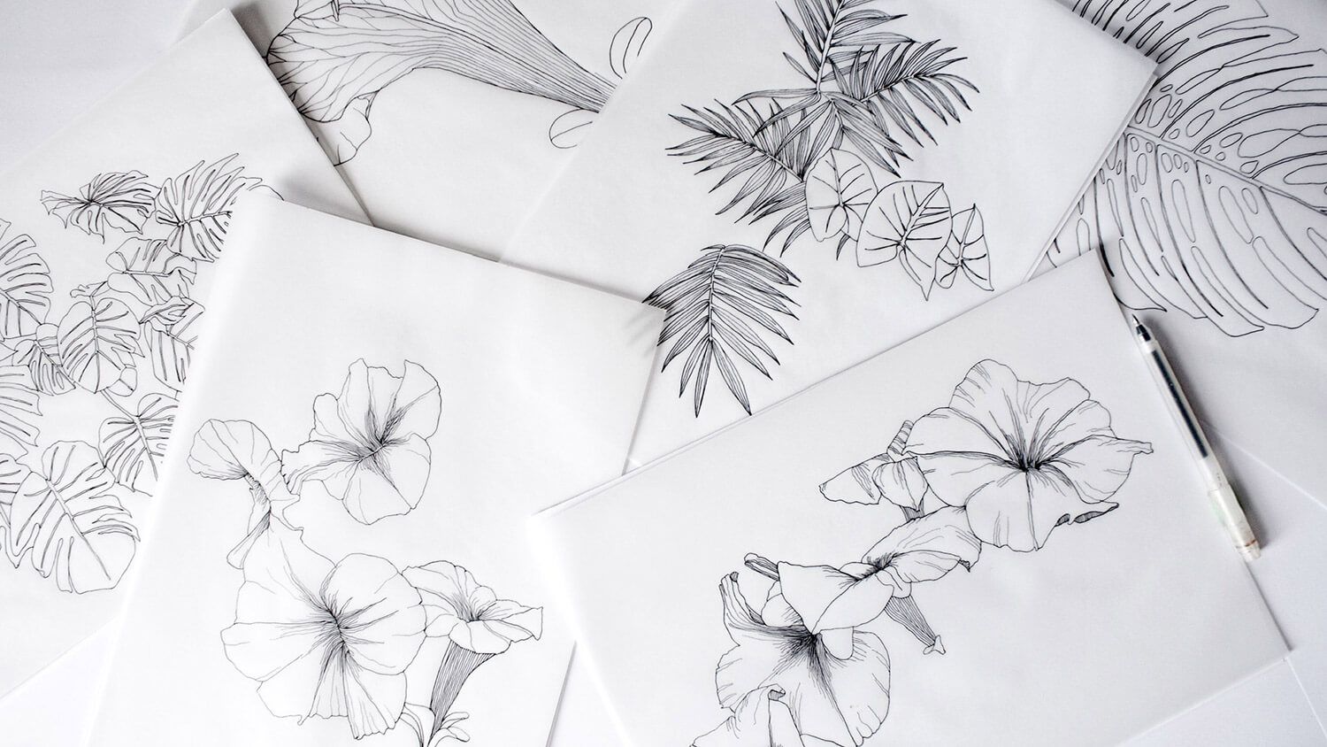 Abstract black-and-white flower sketches on overlapping sheets of paper