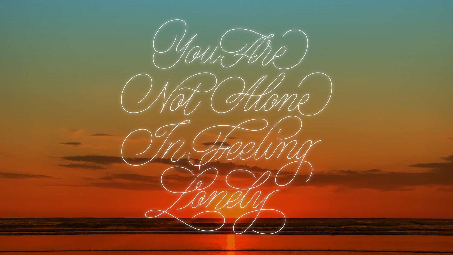 A sunset over the ocean with the cursive white text, 