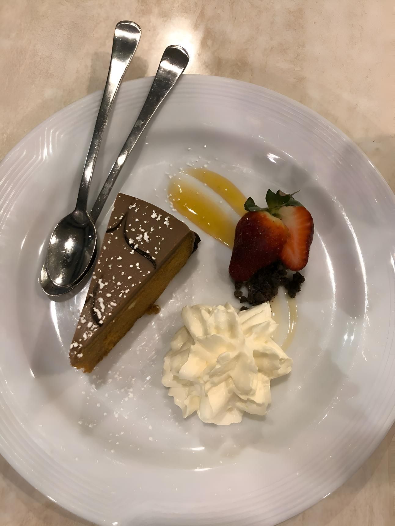 A White Plate Topped With A Piece Of Cake — Stonegrill Huskisson In Huskisson, NSW