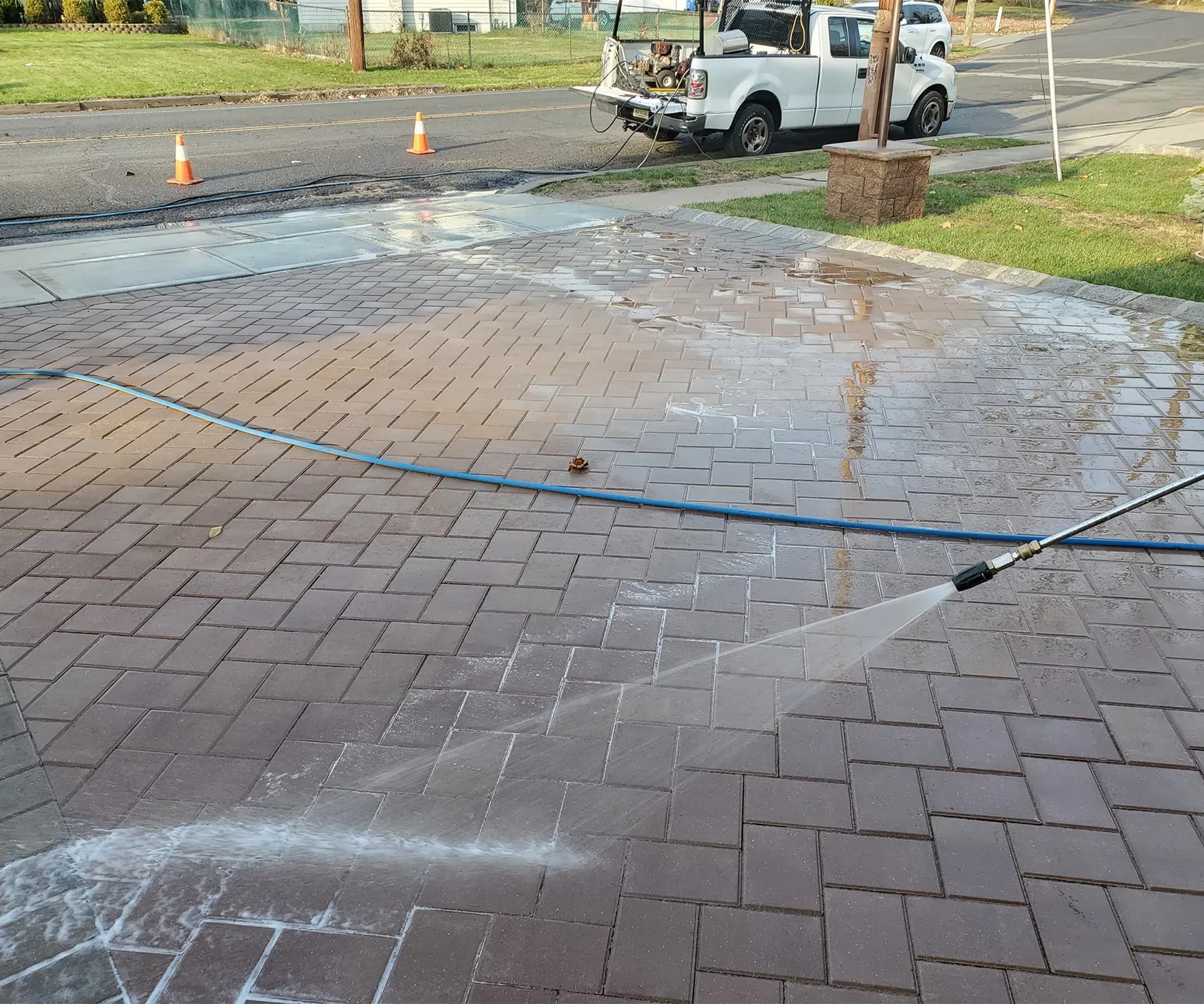 A man is using a drill to drill a hole in a wall.