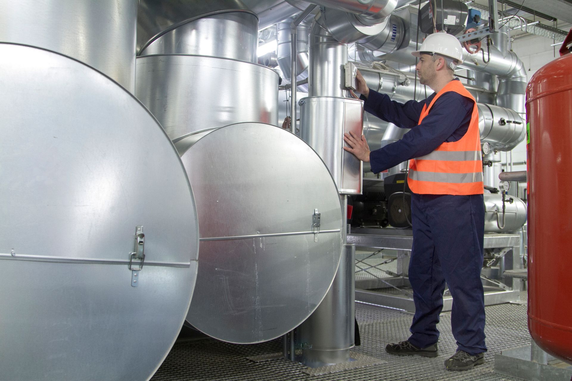 engineer fixing two boilers 