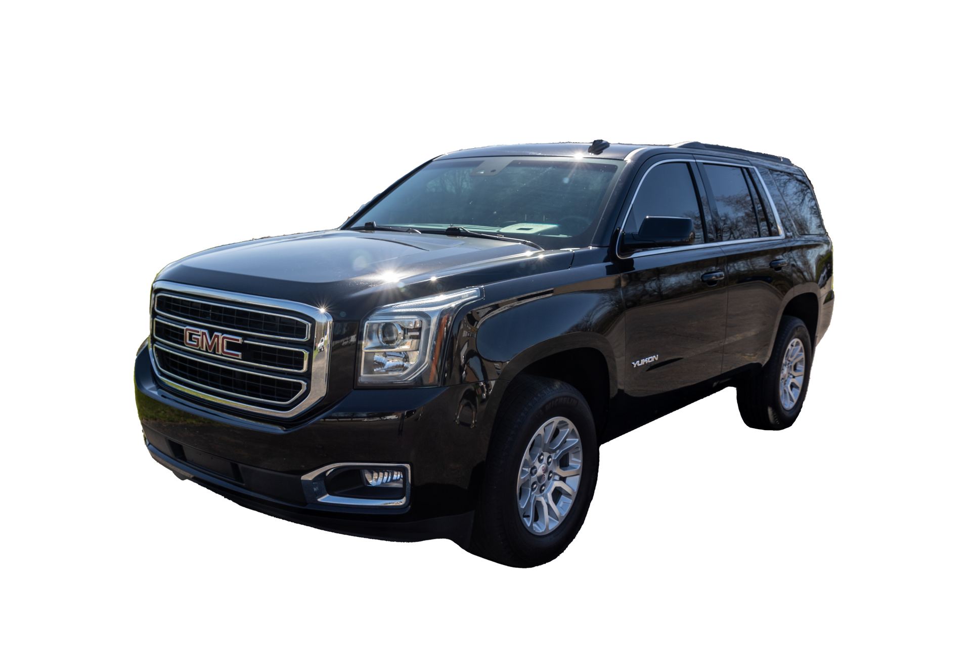 A black gmc yukon is shown on a white background.