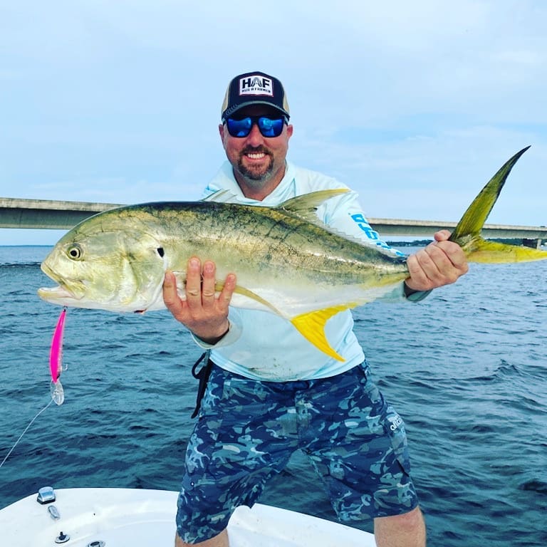 Man Holding A Fish — Destin, FL — Boat Up Fishing Rentals