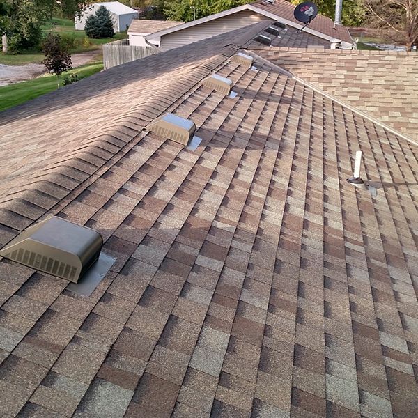 a shot of a roof with asphalt shingles
