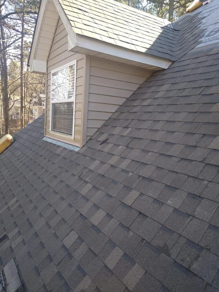 A house with a roof and a window on it.